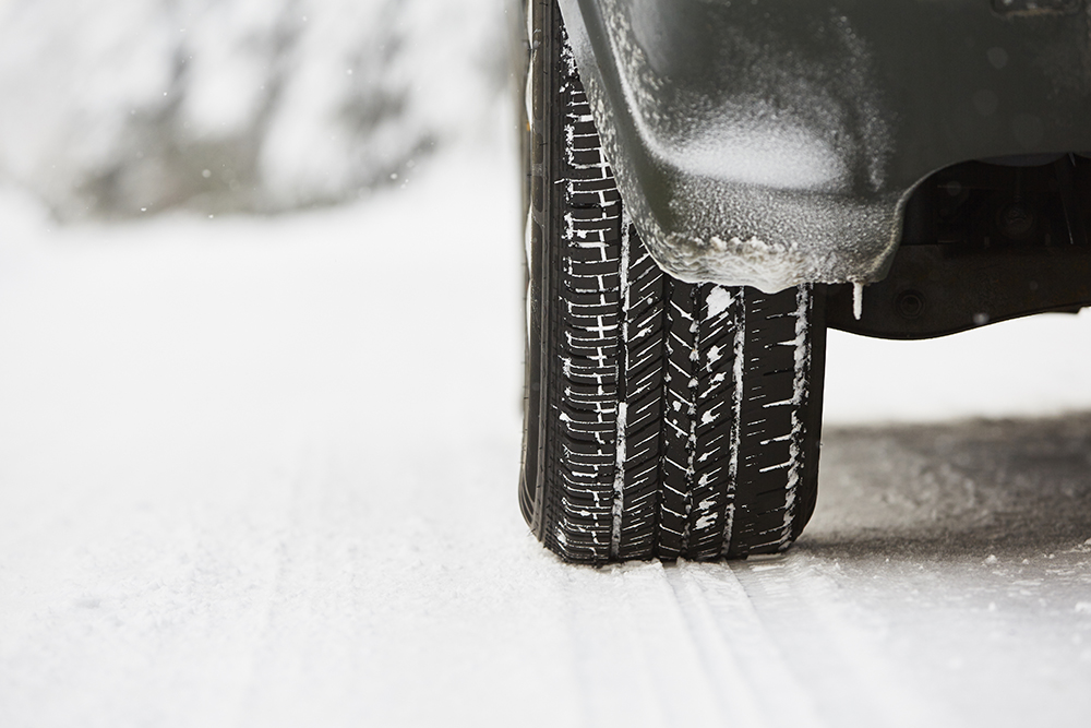 Detail of the tire on winter road